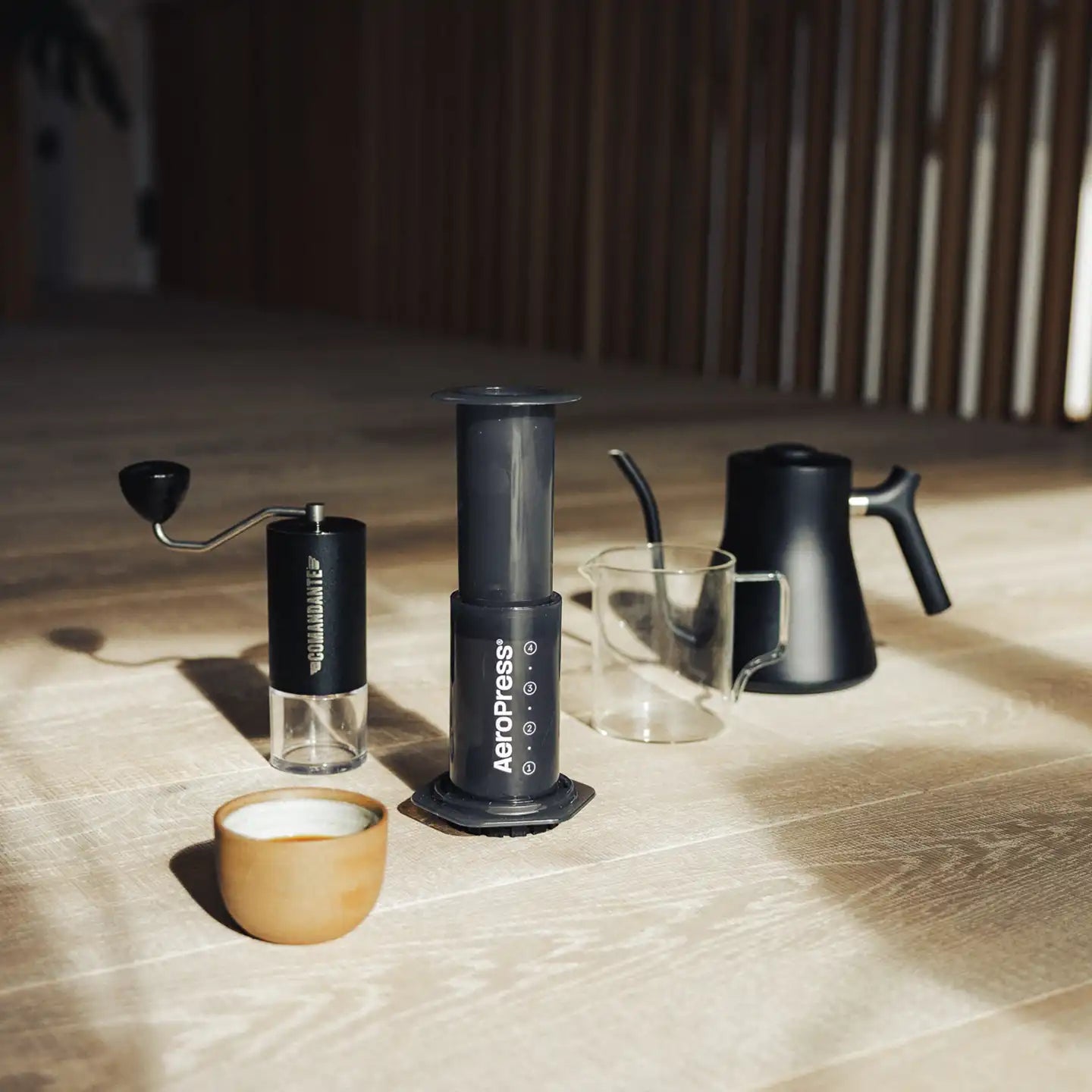 AeroPress on counter surrounded by other coffee brewing devices