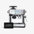  A steel Sage Barista Pro espresso machine featuring a built-in grinder, LCD display, steam wand, and a free 3-month coffee subscription, ideal for making barista-quality coffee at home. 